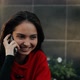 Young Business Lady Talking on a Cell Phone Sitting at a Table in a Cafe on the Street. - VideoHive Item for Sale