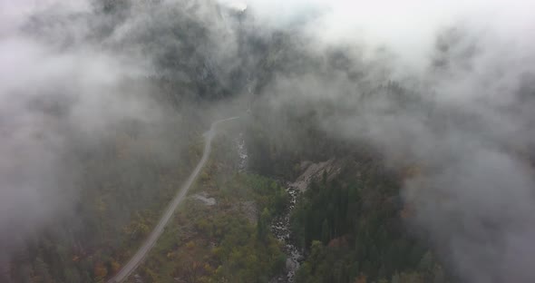 Mountain road in the clouds. Aerial