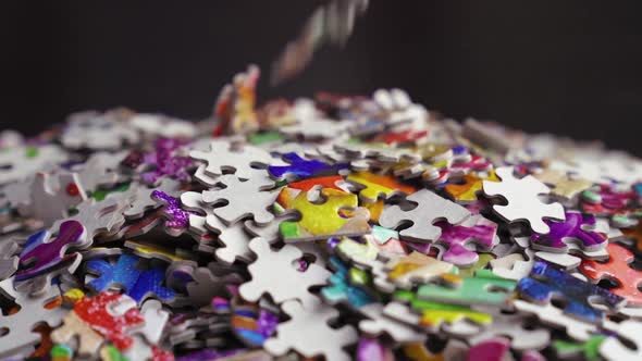Puzzle Pieces Closeup Falling Into A Pile