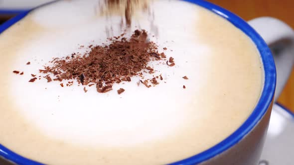Milk Froth in Coffee Cup Sprinkled with Chocolate