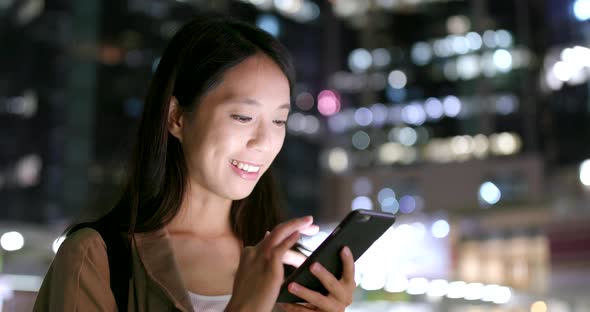 Woman Use of Cellphone for Online at Night