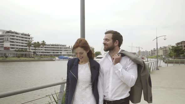 Couple strolling together on boardwalk