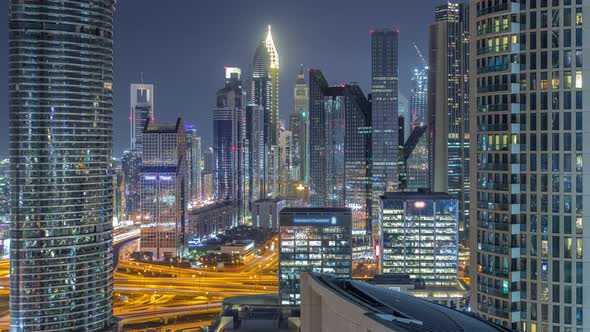 Dubai International Financial Centre District with Modern Skyscrapers Night Timelapse