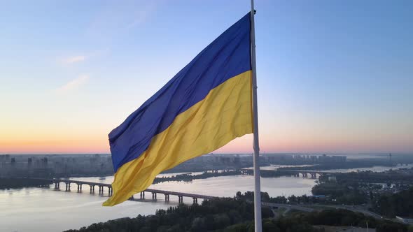 Ukrainian Flag in the Morning at Dawn. Aerial. Kyiv. Ukraine