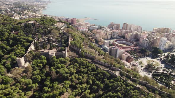 Orbiting around Mount Gibralfaro viewpoint on top of Malaga Coastline city, Spain