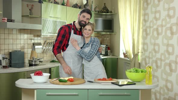 Happy Couple at Cooking Table