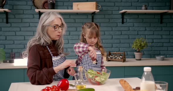 Cute Girl and Her Grandparents Cooking in Kitchen