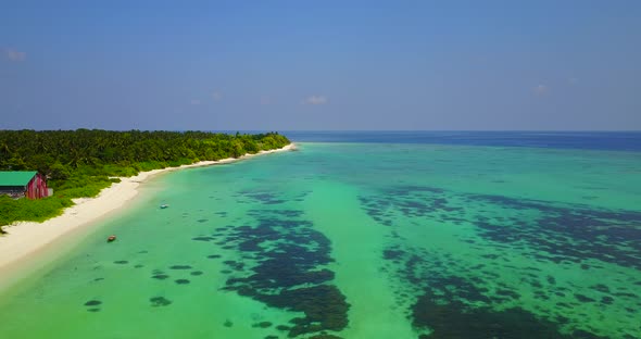 Luxury flying copy space shot of a white sandy paradise beach and blue ocean background in hi res 4K