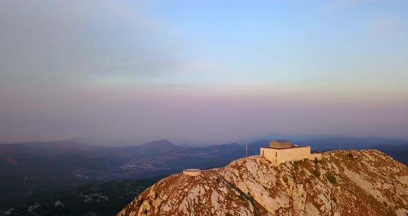 Aerial drone view of a hill top building in Montenegro.