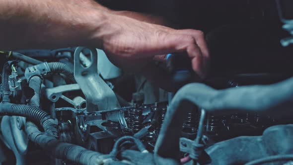 Craftsman in Car Repair Shop Fixes Cars View of Car Parts Images