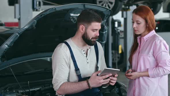 Mechanic Making Deal with Female Customer