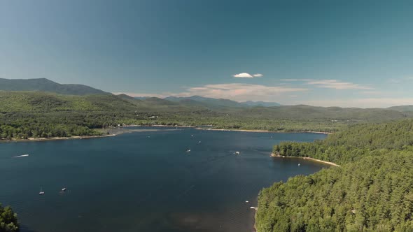 Aerial drone view over adirondack lake in the summer