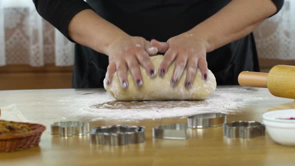 Close Up Female Hands Kneading Yeast Dough on Table Sprinkled with Flour