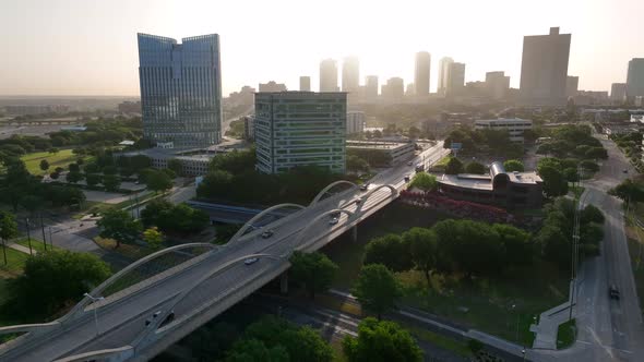 Dallas Fort Worth metro region. Ft Worth skyline. Aerial pullback reveal in magic light at Trinity R