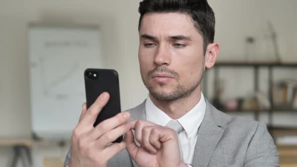 Businessman Browsing Smartphone