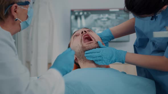 Patient with Caries Problems Receiving Consultation From Dentistry Team