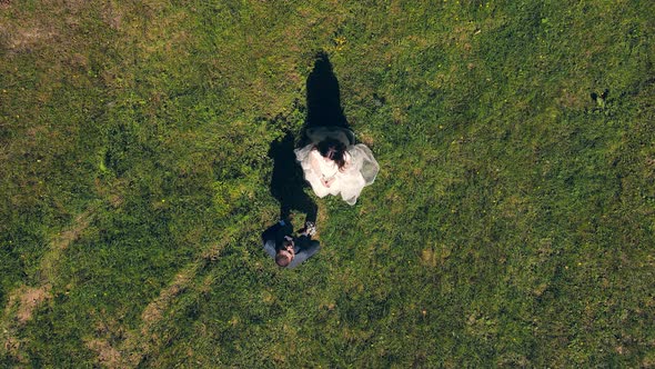 The Groom Throws a Wedding Bouquet Into the Drone Chamber. The Wedding Bouquet Falls Into the Drone.