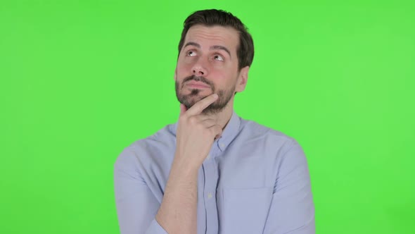 Portrait of Pensive Man Thinking Green Screen