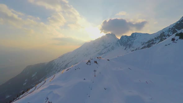 Majestic Mountain Range, Snow Groomer Cleaning Skiing Run, Extreme Sport, Resort
