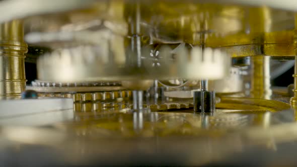 Inside View of Moving Clockwork of Golden Mechanical Clock