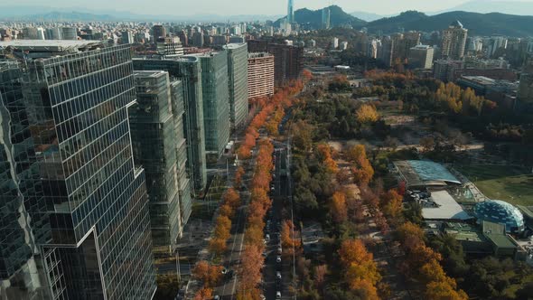 Aerial View Of Araucano Park In Autumn Colors With Skyline Of Santiago, Chile.