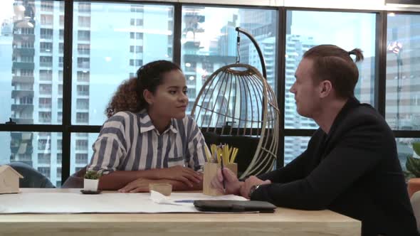 Creative Business People Group Having Conversation at Office Desk in Workplace