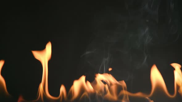 Fire flames and smoke over black background