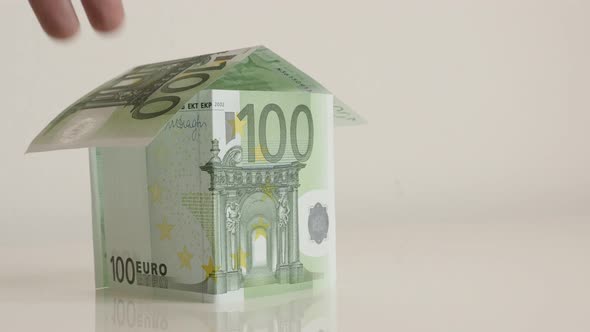 Money house building metaphor with EU banknotes 4K 2160p 30fps UltraHD footage - Real estate concept