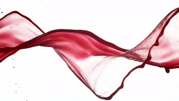 Super Slow Motion Shot of Red Wine Spiral Splash Isolated on White Background at 1000Fps