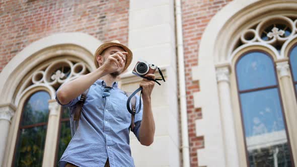 Stylish Male Traveller Photographing Tourist Attractions When Sightseeing In City