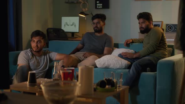 Indian Men Watching Match and Making Bets