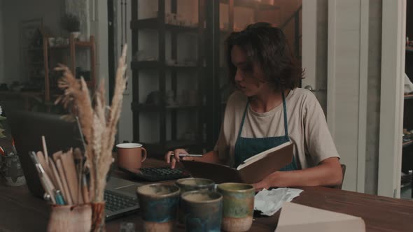 Woman Taking in Pottery Workshop