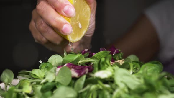 Squeezing Lemon Juice On The Salad