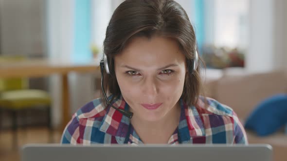 Portrait of Woman Teacher Wear Wireless Headset Video Calling on Laptop Having Online Lesson