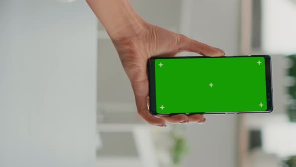 Vertical Video Business Woman Browsing on Internet Using Mock Up Green Screen Chroma Key Smartphone