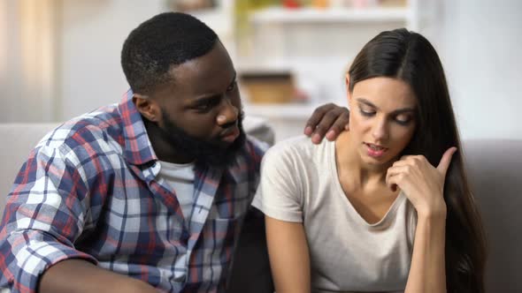 Afro-American Man Consoling His Upset Wife, Health and Life Problems, Support