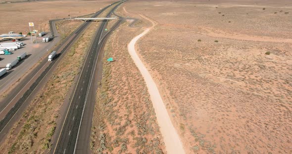 Horizontal Panorama Trucks Stop on Rest Area Near Interstate Highway in Desert Arizona