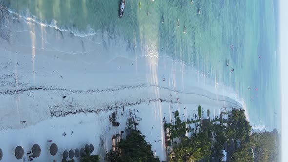 Vertical Video Boats in the Ocean Near the Coast of Zanzibar Tanzania Aerial View