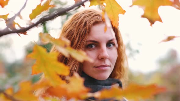 Young Beautiful Woman In Autumn Forest Explore and Enjoy Nature