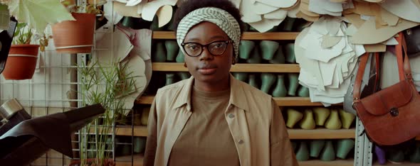 Portrait of African American Female Shoemaker in Workshop