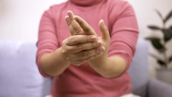 Women doing hands stretching after intense home office day protect office syndrome. Health care conc