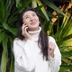 Young Asian Woman Use the Phone with Earphones While Walking - VideoHive Item for Sale