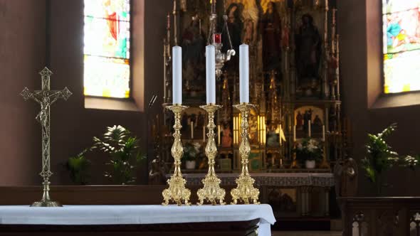 Religious Three Candles Against the Altar Inside the Catholic Chapel