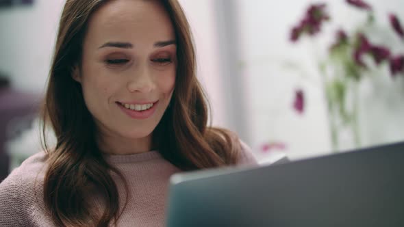 Portrait of Happy Woman Smiling While Making Video Call at Laptop