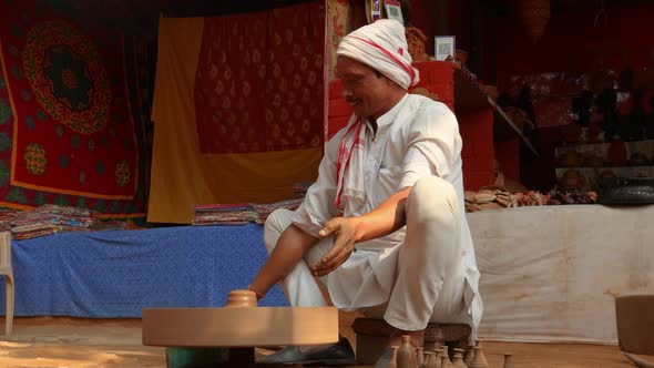 Potter at Work Makes Ceramic Dishes