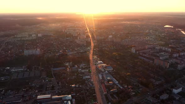 Sunset Over City Streets Aerial View