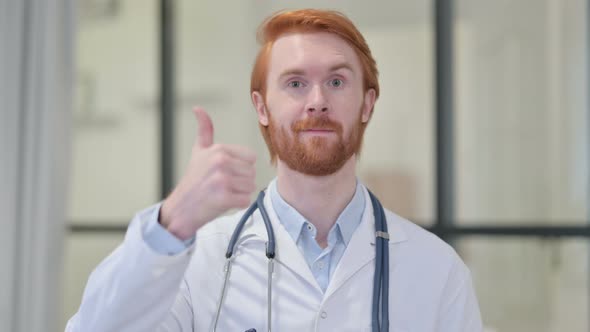 Portrait of Thumbs Up Sign By Redhead Male Doctor 
