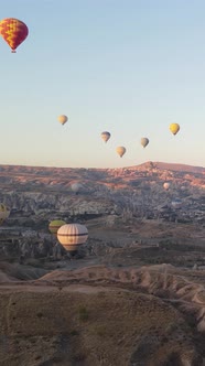 Vertical Video of Hot Air Balloons Flying in the Sky Over Cappadocia Turkey