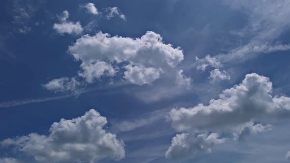 White Fluffy Clouds in the Blue Sky