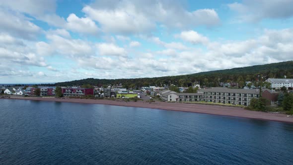 Drone shot of downtown Grand Marais, MN on a sunny summer afternoon